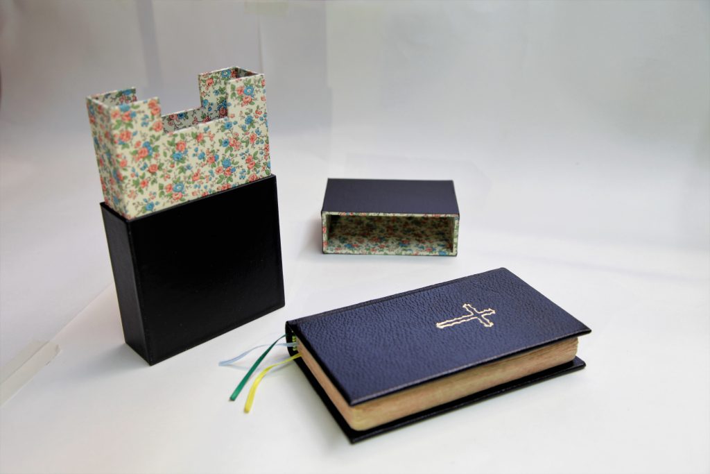 Solander box for a small hand missal in black with floral paper lining
