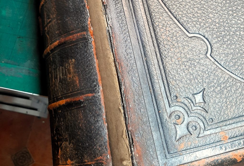 Family Bible after duct tape residue removal