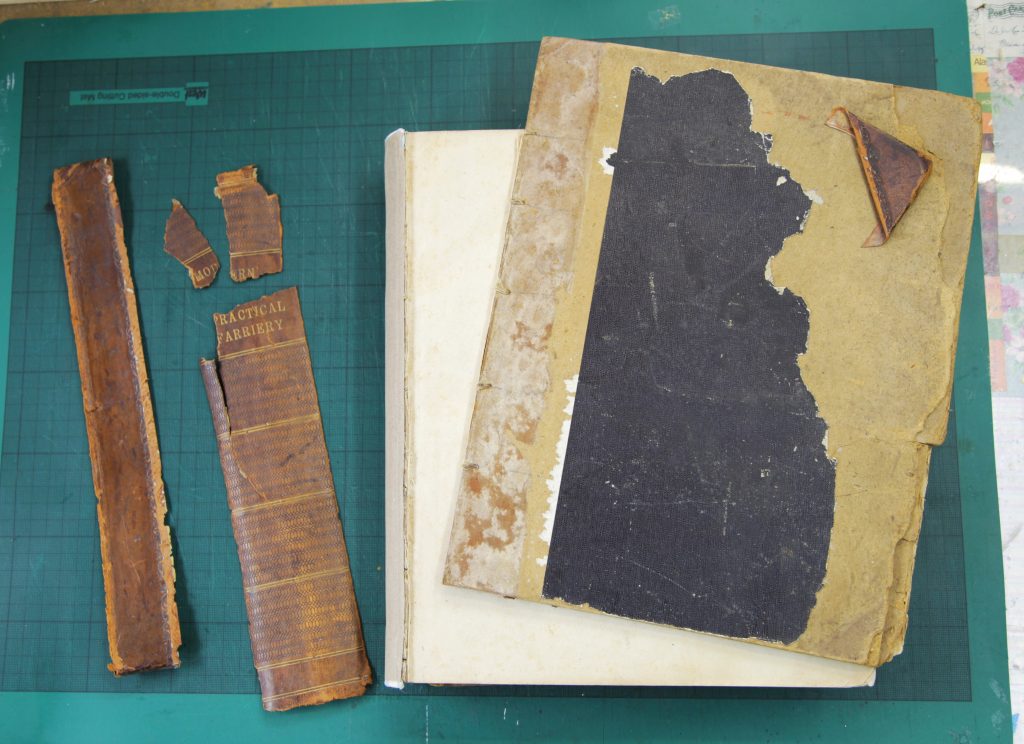 Antique book with detached boards and broken spine