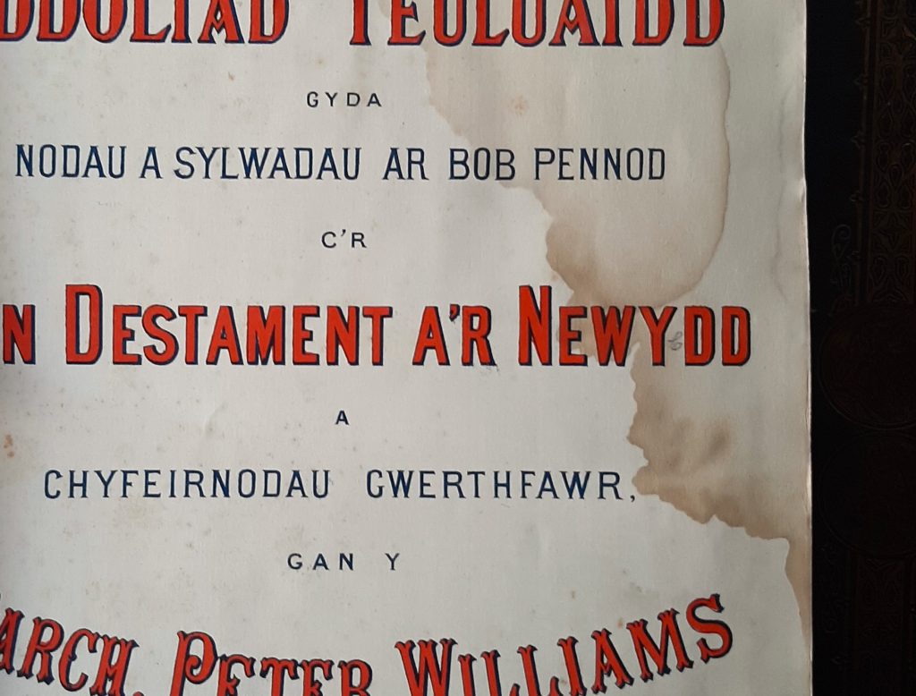 Welsh Bible with prominent tea or coffee stain